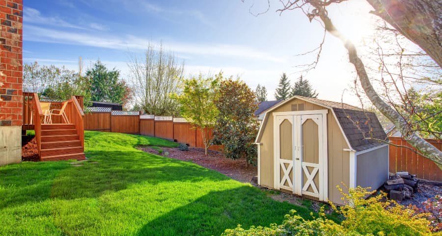 Fenced backyard with storage shed in Arlington